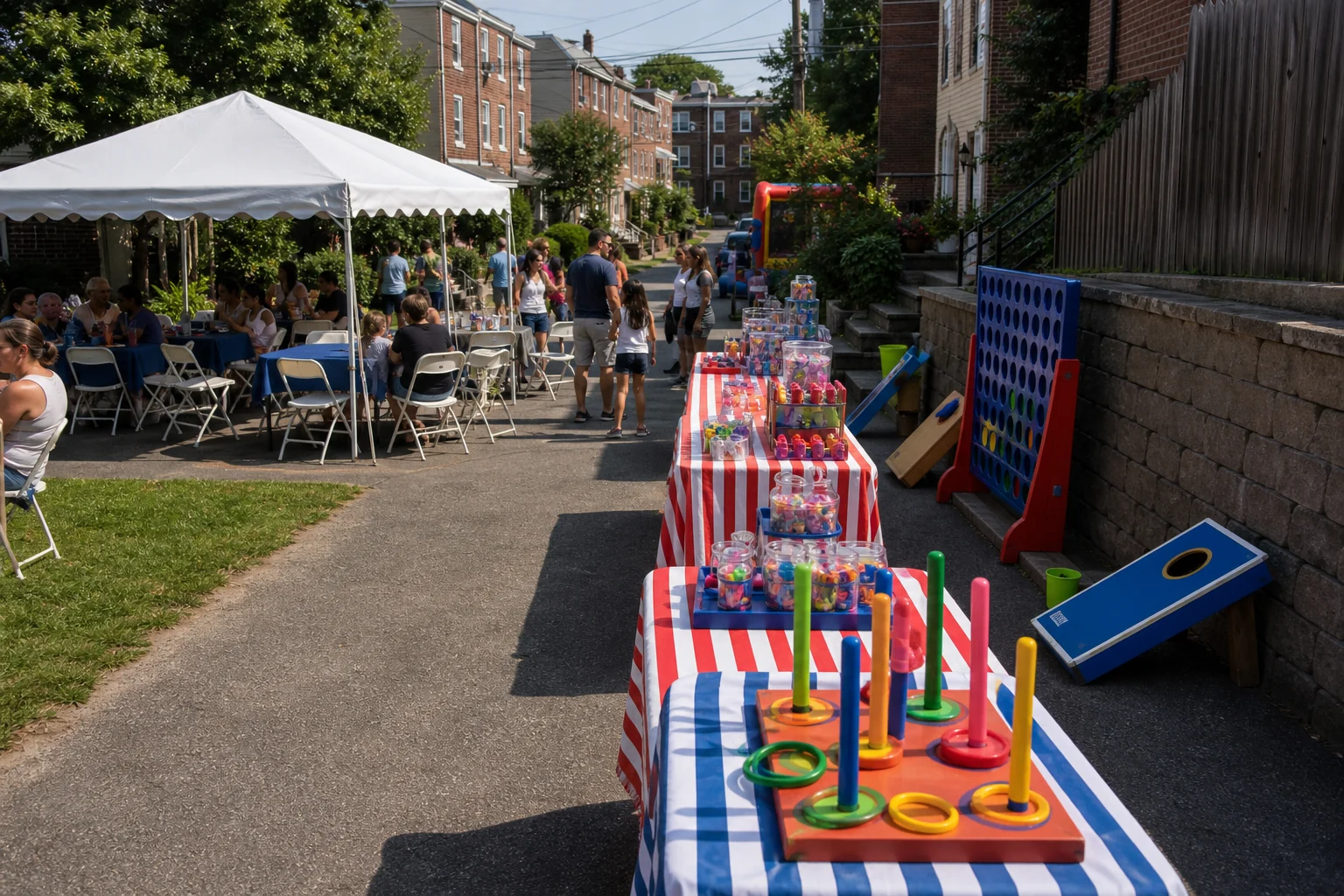 From a host’s point of view, manayunk and Roxborough carnival game setup with tent seating, compact game tables, blank prize area, and neighborhood backdrop