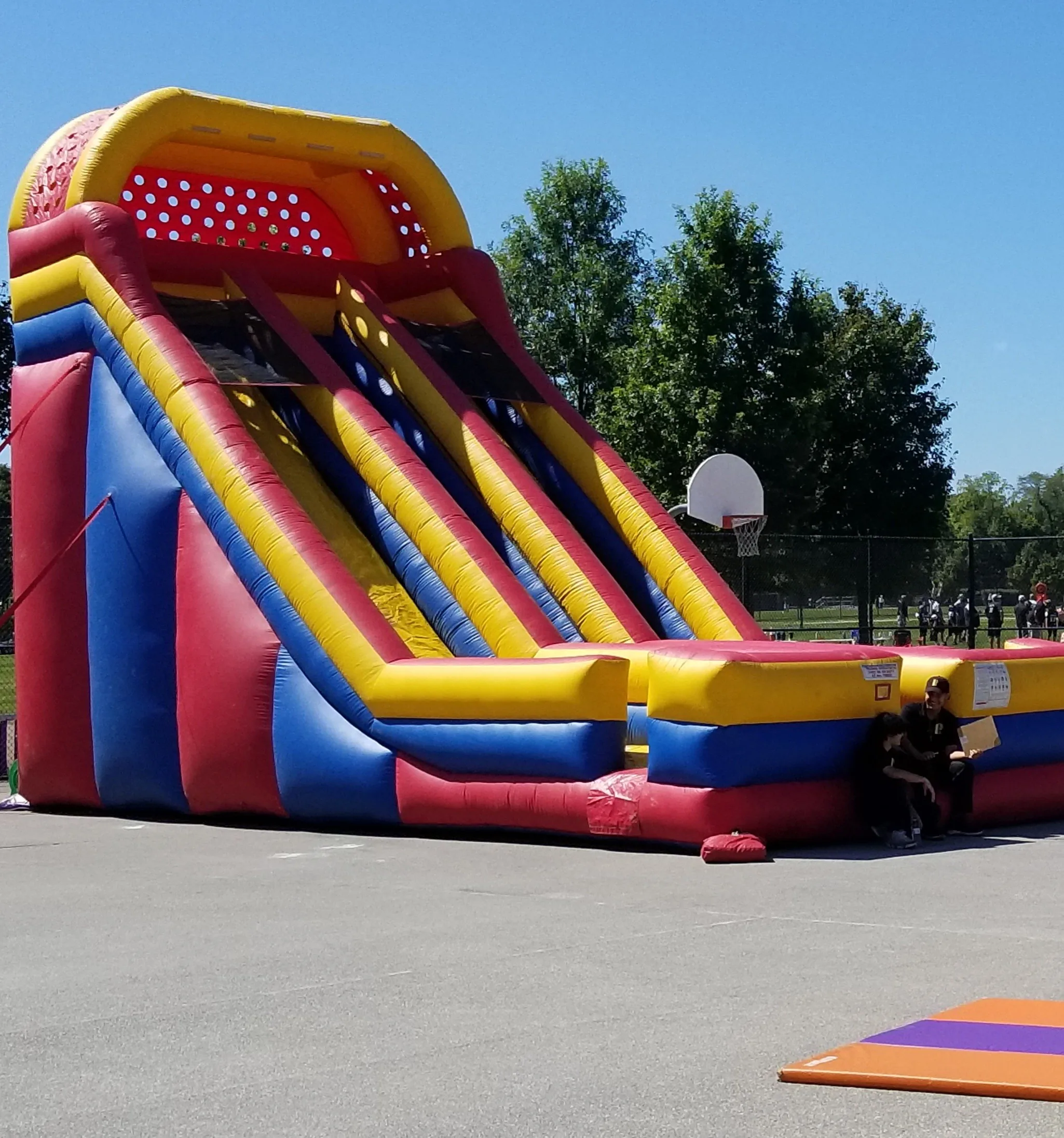 Dual-lane dry slide in primary colors on asphalt