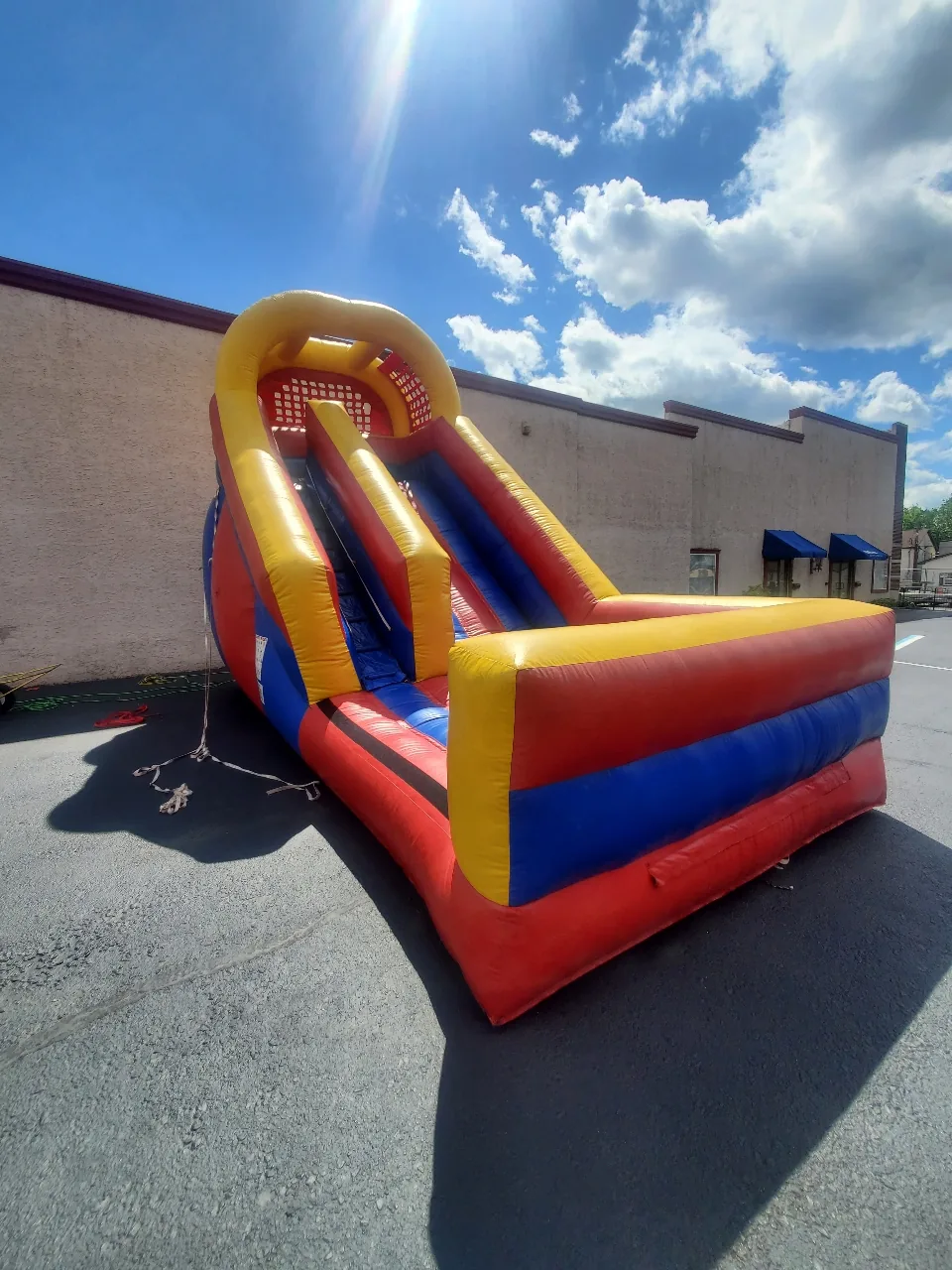Classic single-lane dry slide in red, yellow, and blue