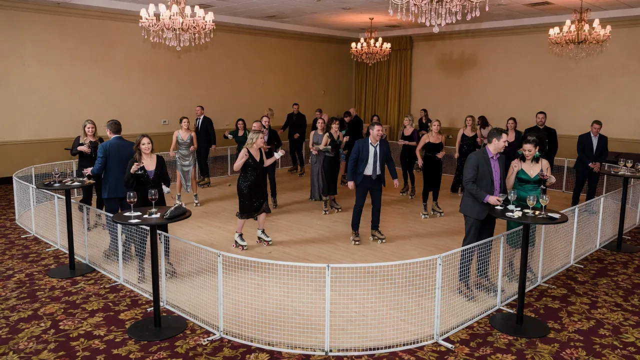 Portable roller rink rails, skates, and event lighting prepared inside city venues, convention rooms, and private event spaces