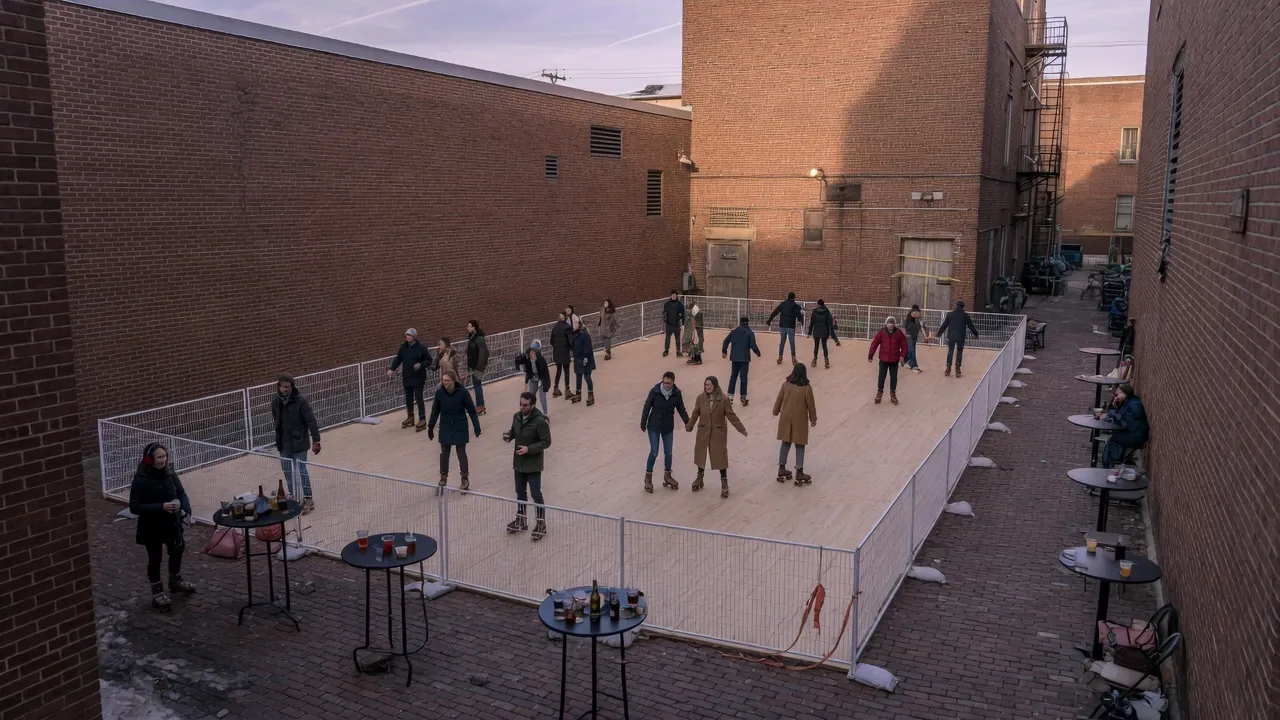 Students skating on a modular roller floor inside a gym