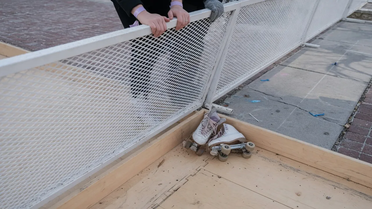 Editorial photo of event fencing and a guest path on a Lancaster-style pad; not a specific venue