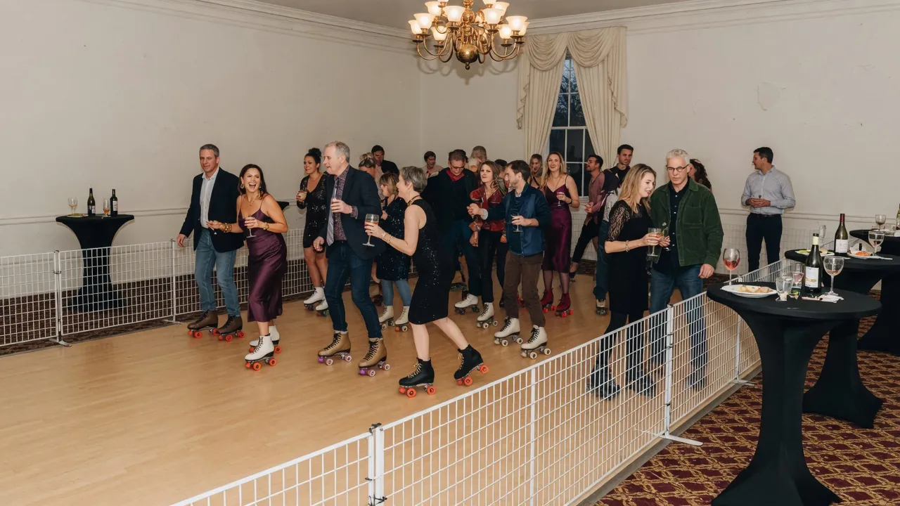 Families watching a managed campus roller skating session