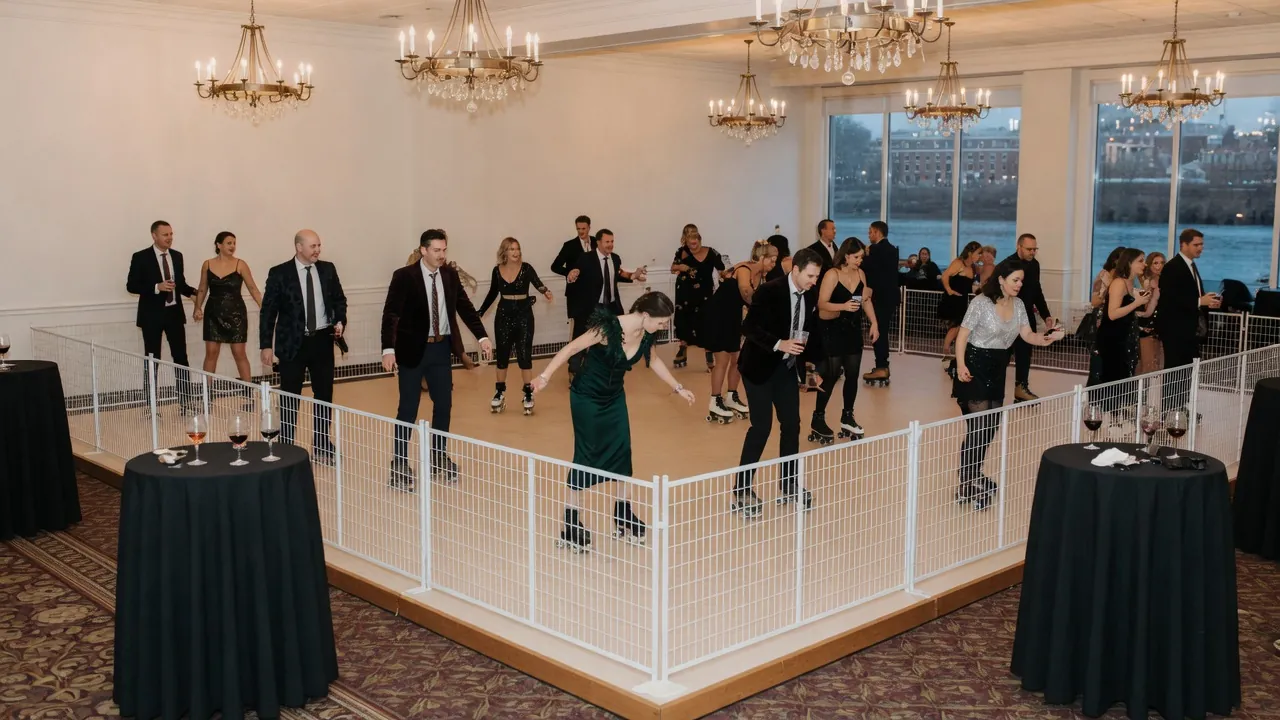Portable roller rink rails and lighting prepared in a ballroom