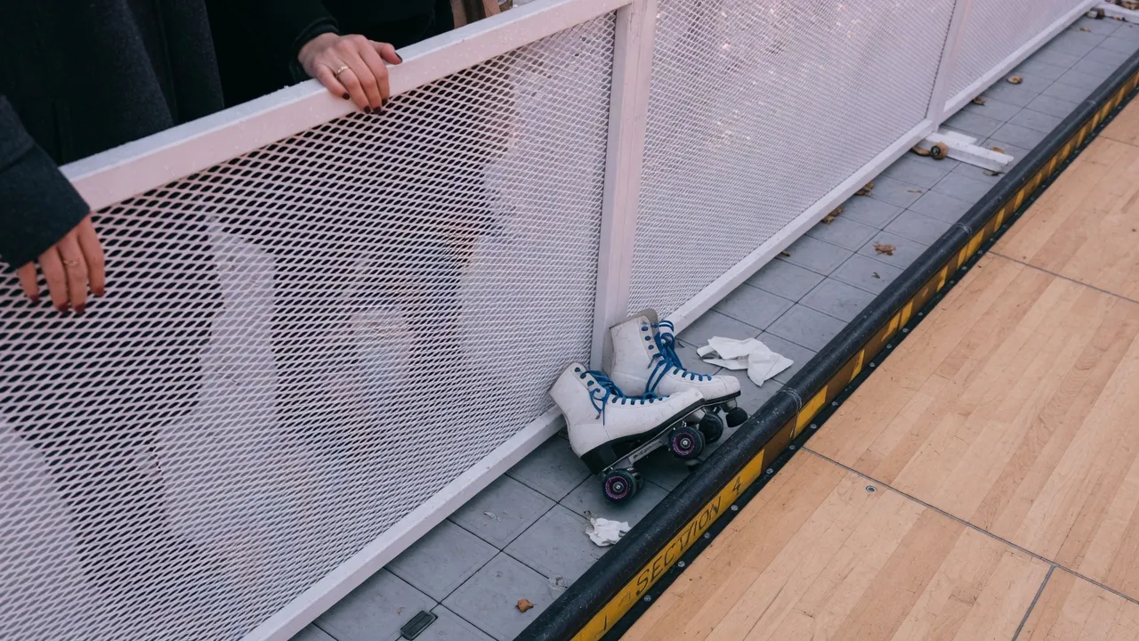 Spectators watching a managed shopping-center skating activation