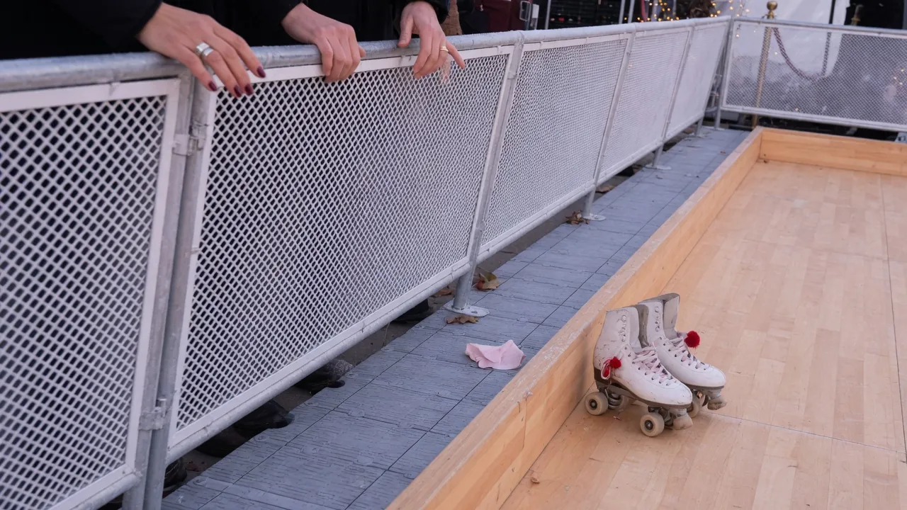 Portable roller rink set up at a winter holiday party in a Rochester-style setting; not a specific venue
