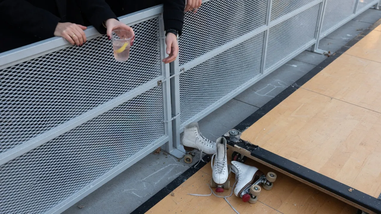 Editorial photo of event fencing on a Saratoga Springs-style pad; not a specific venue