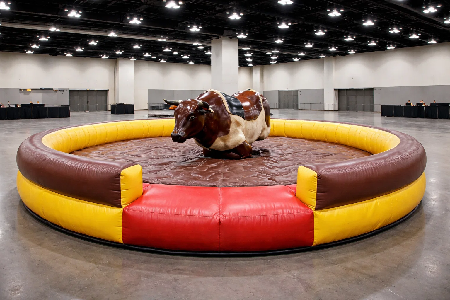 Mechanical bull rental setup showing space and padded inflatable base